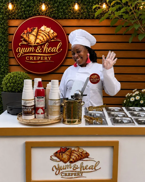 Yum&Heal owner smiling in her apron at the crepe station